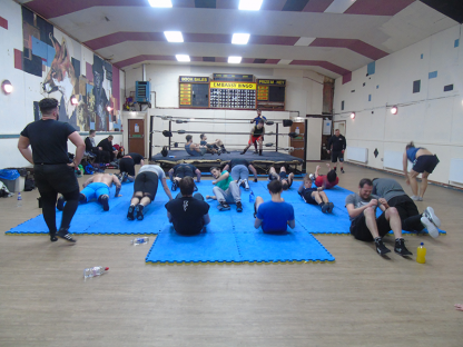 A group of men are exercising on mats