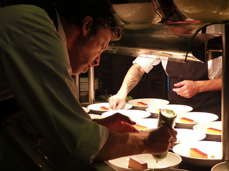 Chefs Wil Atkinson and Gareth Hobbs serving up a dish at their last pop up event