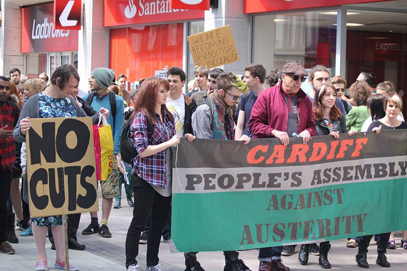 people stand in Queen Street to protest against austerity