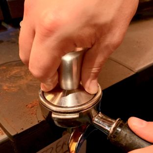 Coffee being tamped