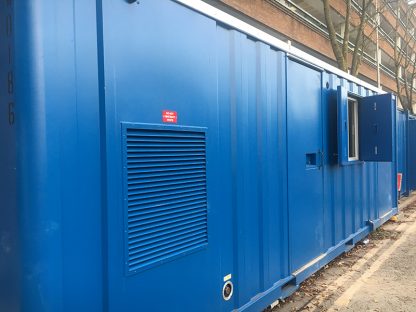 photo of a shipping container that would be used as a home for the homeless