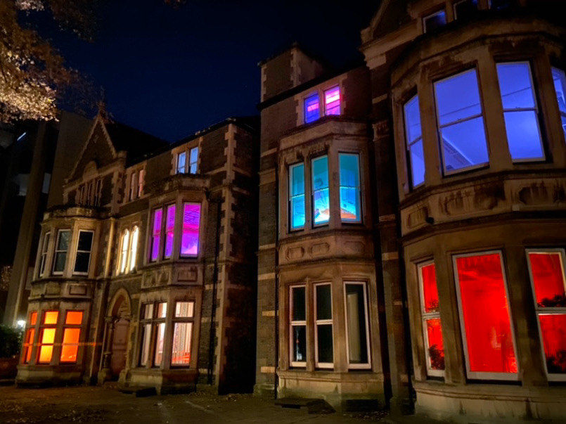 The building where the Under the Counter Culture event is being held is lit up from inside 