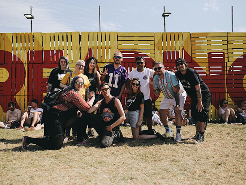 A photo of Morgan Richards with friend and co-host of Sappenin' Podcast, Sean Smith, at Reading Festival 2019 with fans of the Podcast.