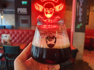 A photo of a stout beer at a bar in Cardiff