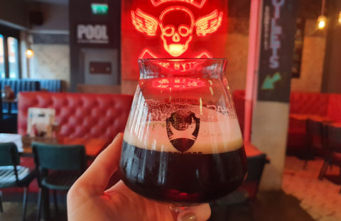 A photo of a stout beer at a bar in Cardiff