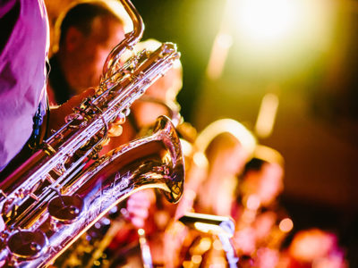 playing a saxophone at music event