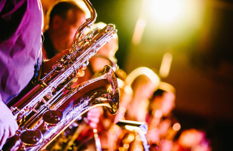 playing a saxophone at music event