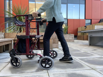 person walking with a walking frame