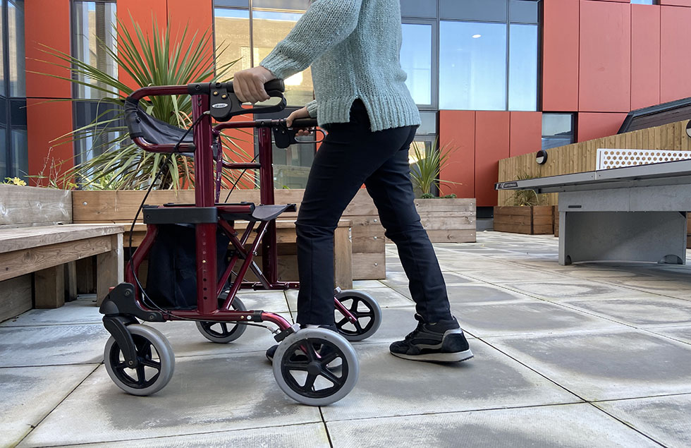 person walking with a walking frame