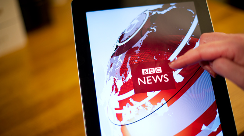 A tablet with BBC news on the screen