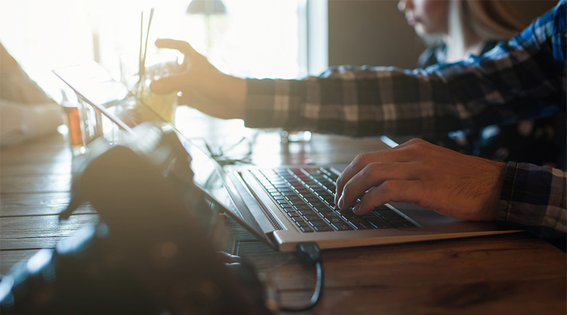 A young person using a laptop